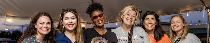 A group of people smiling